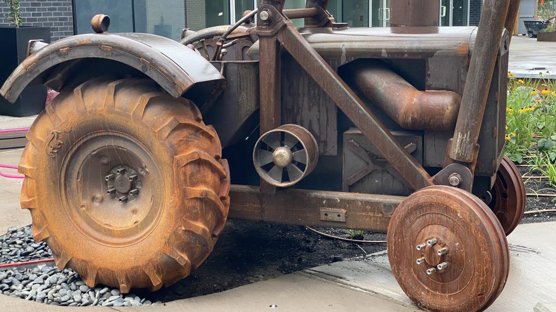 Close up of a tractor sculpture.