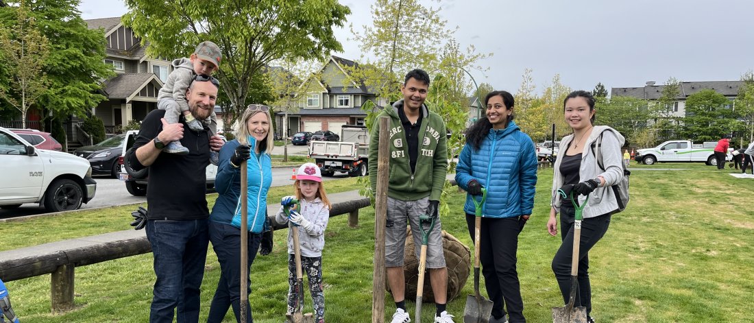 Surrey residents participating in an Arbor Day tree planting event
