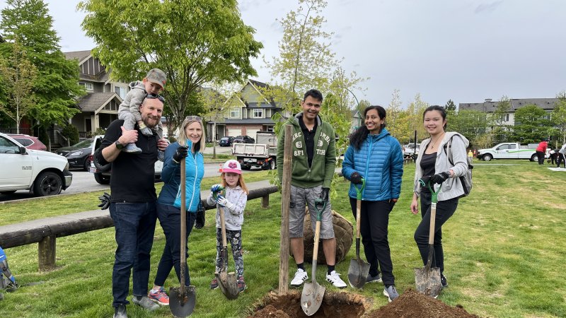 Surrey residents participating in an Arbor Day tree planting event