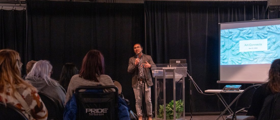 a man gives a presentation to an audience