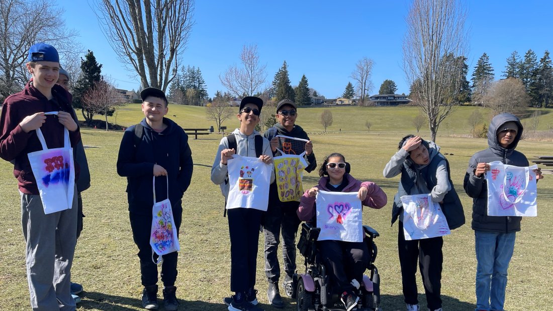 Social Recreation - Youth on the Move participants displaying their art work.