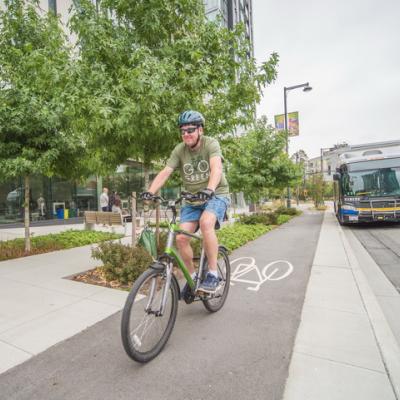 Man biking in a bike lane