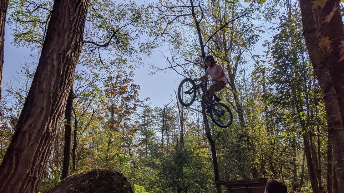 A person jumping their bike