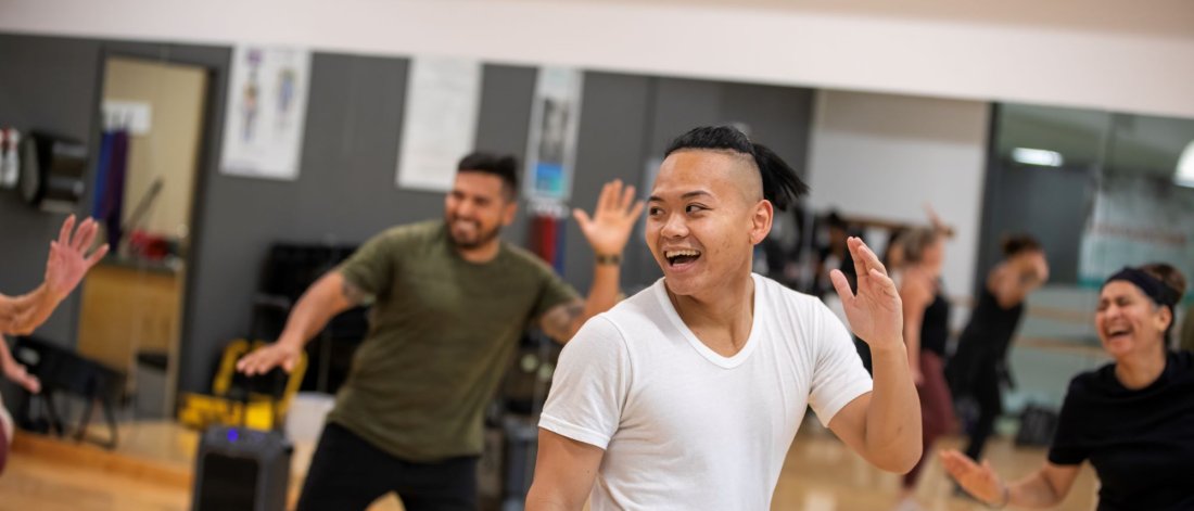 A person dancing in a fitness class.
