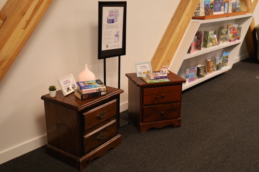 Community Art project with a stack of books on top of bedside tables