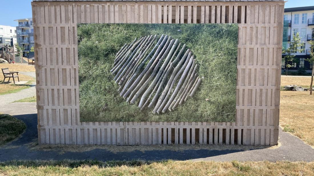 A small building with public art Branch Round on one wall