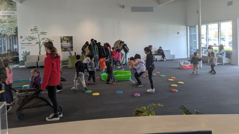 kids and their parents taking part in a Stay and Play for Father's Day at the Museum of Surrey