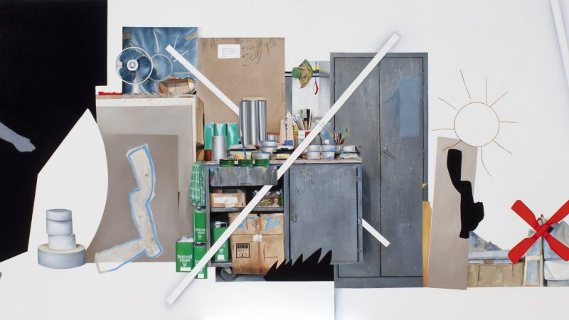 White walls and floor show a room with closet doors and cabinets. The closet doors and cabinets are painted a slate colour. There are Tupperware containers and paintbrushes sticking out of tins on the cabinet tabletop. The cabinet shelves are open and sow cardboard boxes and green tins that say “turpenoid natural.” Two lines cross in front of and behind the cabinet, appearing like the letter X.  To the left of the cabinet are stacks of frames and on top is an air conditioner fan. The cut-out of a person wal