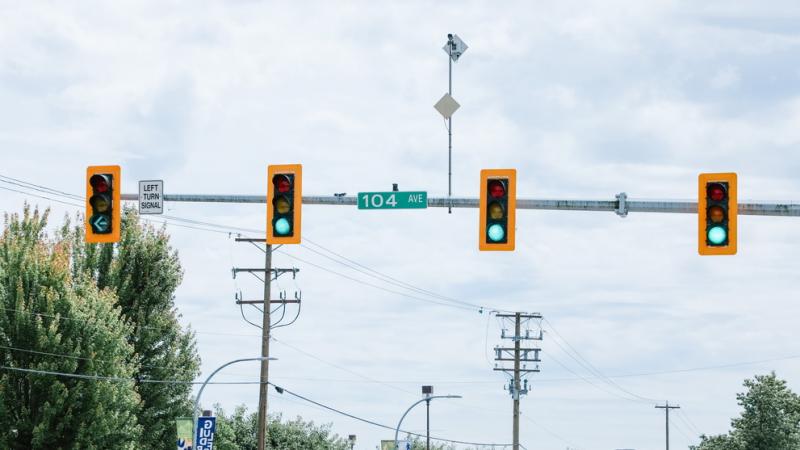 Four green lights, one with an arrow