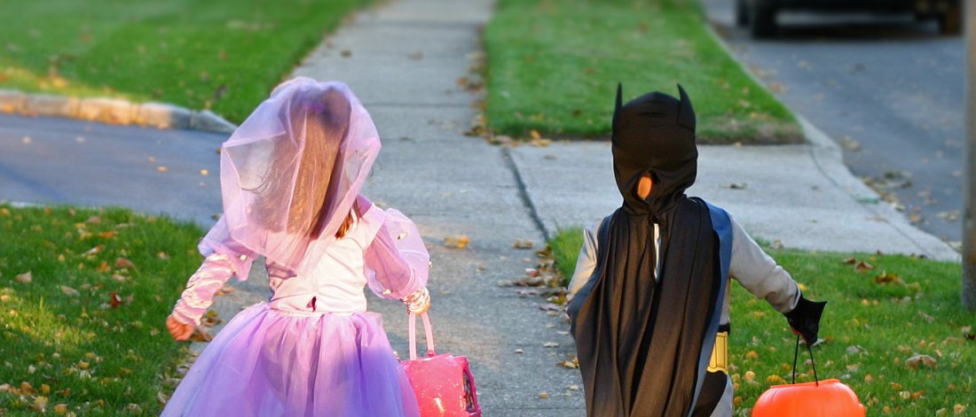 two kids in costumes