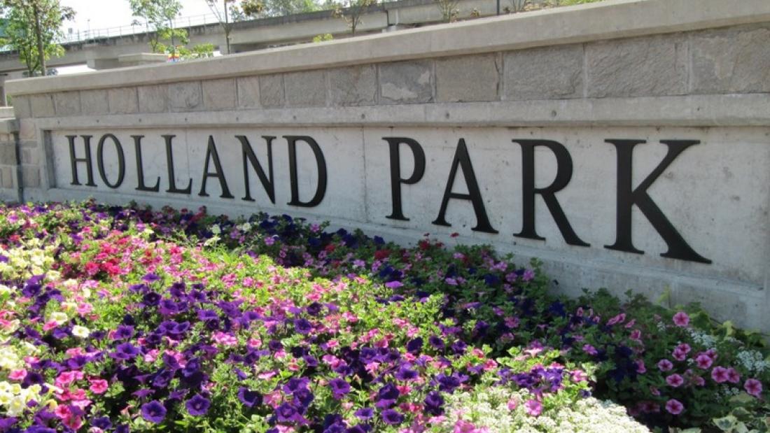 Large concrete sign that says Holland Park