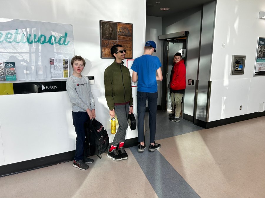 Kids waiting for the washroom in a lineup.