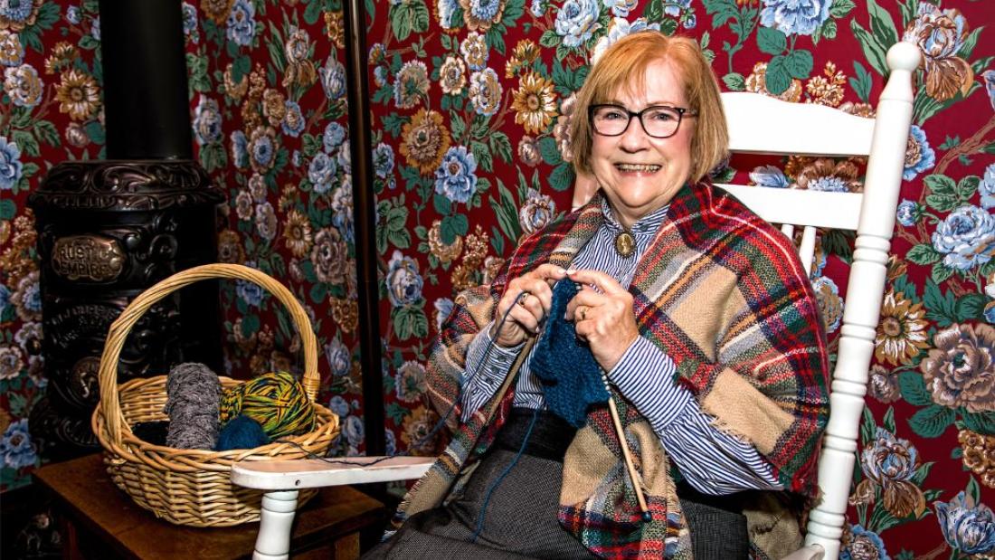 A volunteer knitting