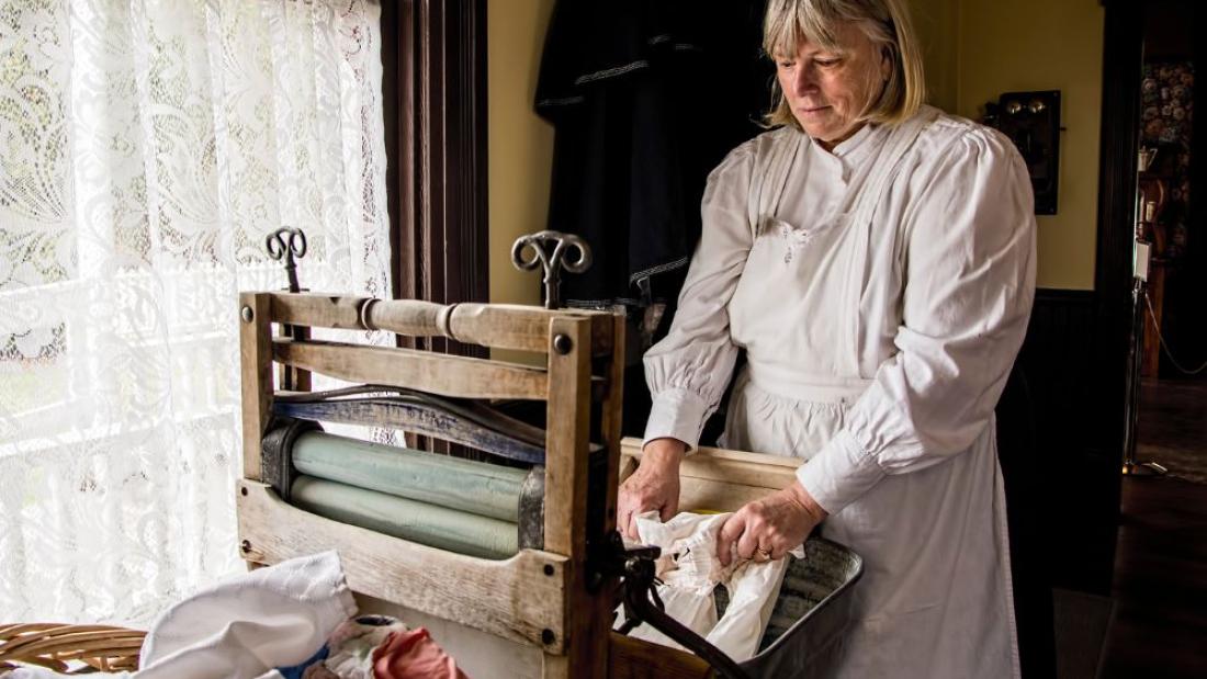 A volunteer doing laundry by hand
