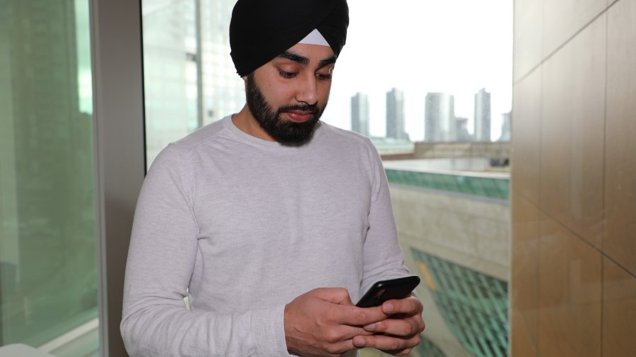 man looking at phone