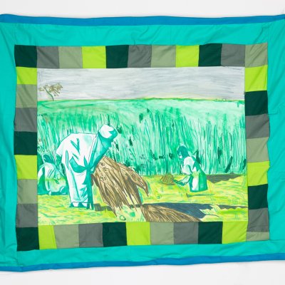 Quilt with various green squares bordering a scene of farmworkers pulling up hay against a tall grassy field.