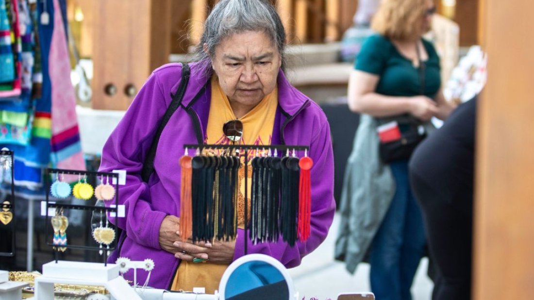 A woman looking at jewelry