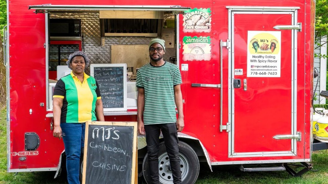 Two people by a food truck