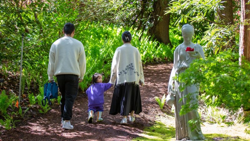 Family walking through pathway at The Glades