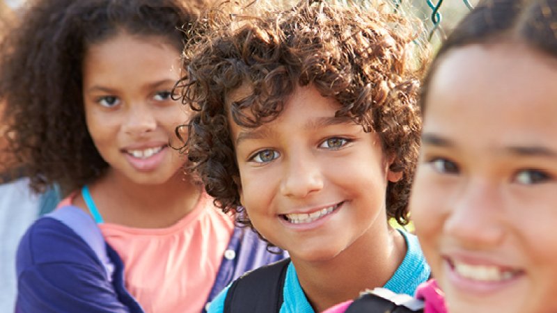 Four children smiling.