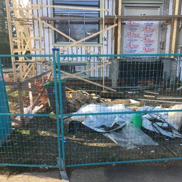 Fencing in front of a house under construction