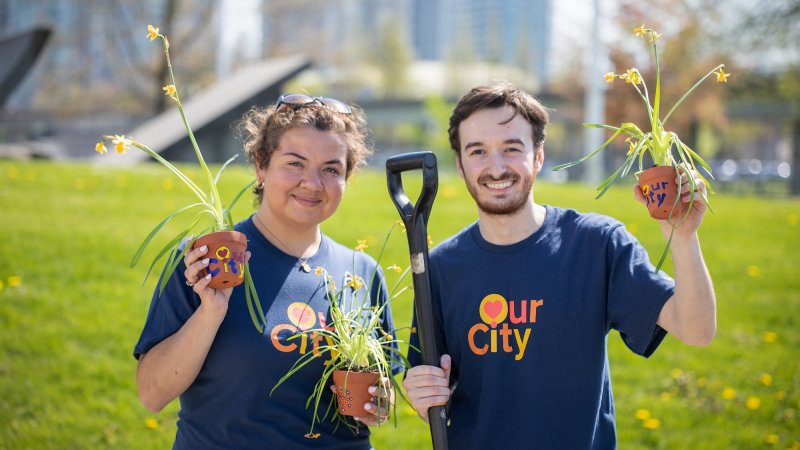 two people with plants