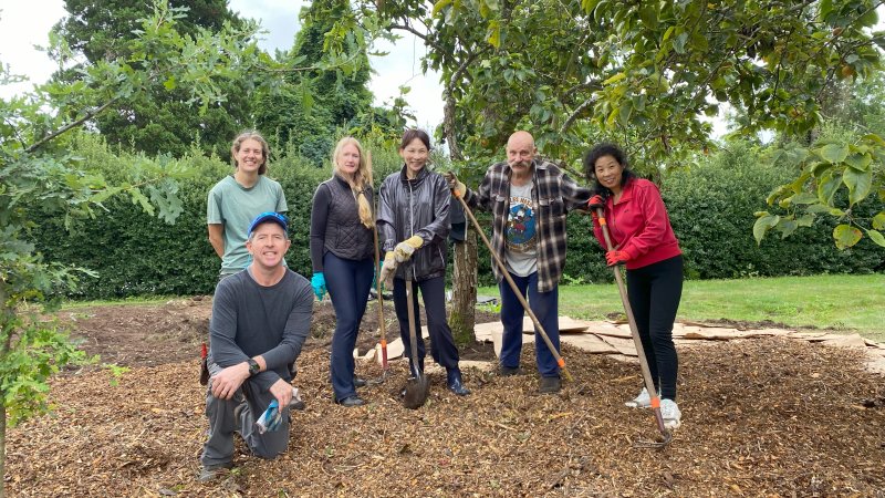 A group of volunteers working in a park