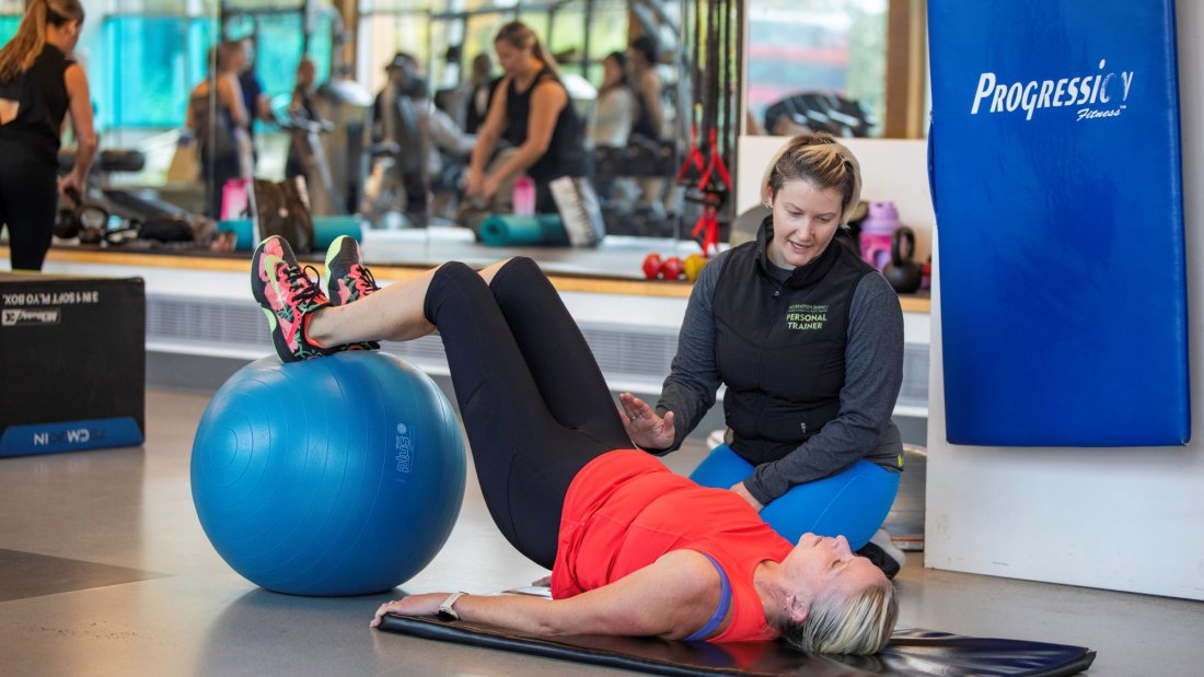 A personal trainer and their client.