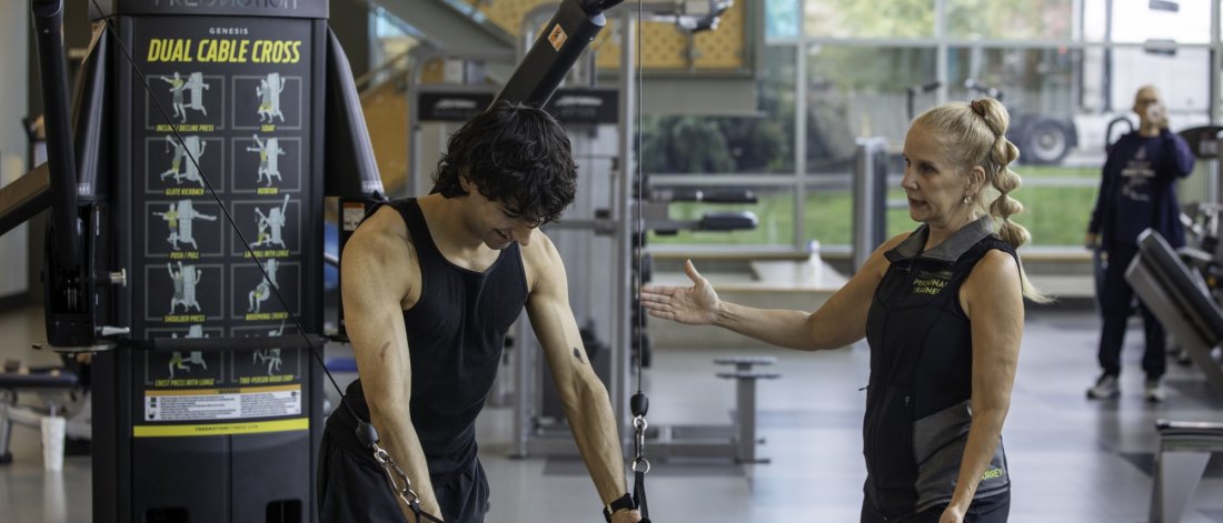 A personal trainer and their client.
