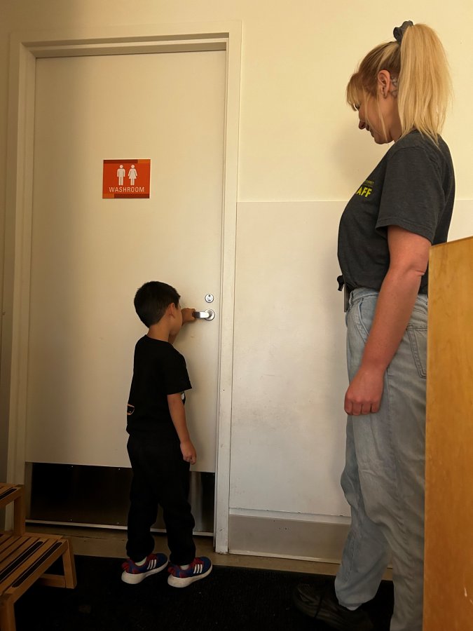 child entering washroom