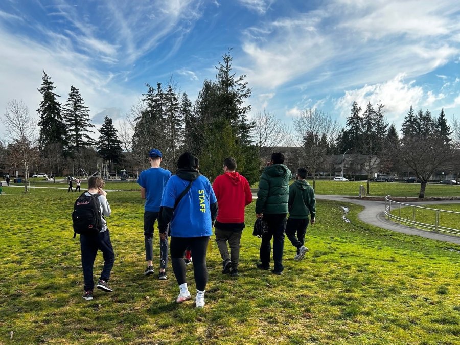 A group of kids walking on a playground.