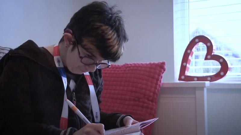 Woman sitting and writing