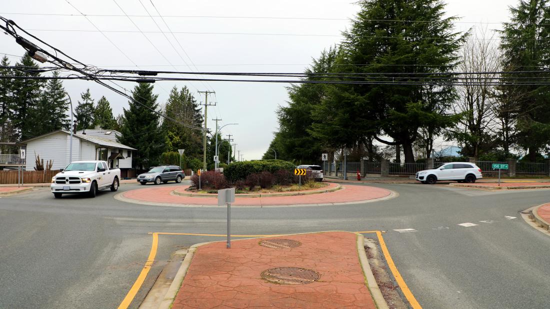 roundabout with vehicles in it 