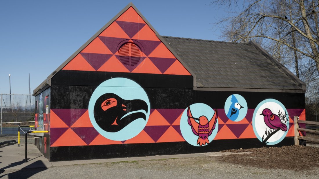 Mural at Black Spit Park washroom facility featuring artwork by Semiahmoo artist, Roxanne Charles.