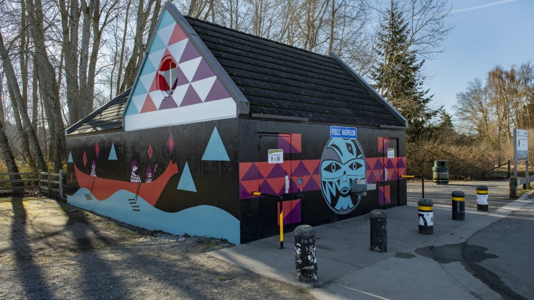 Mural at Black Spit Park washroom facility featuring artwork by Semiahmoo artist, Roxanne Charles.