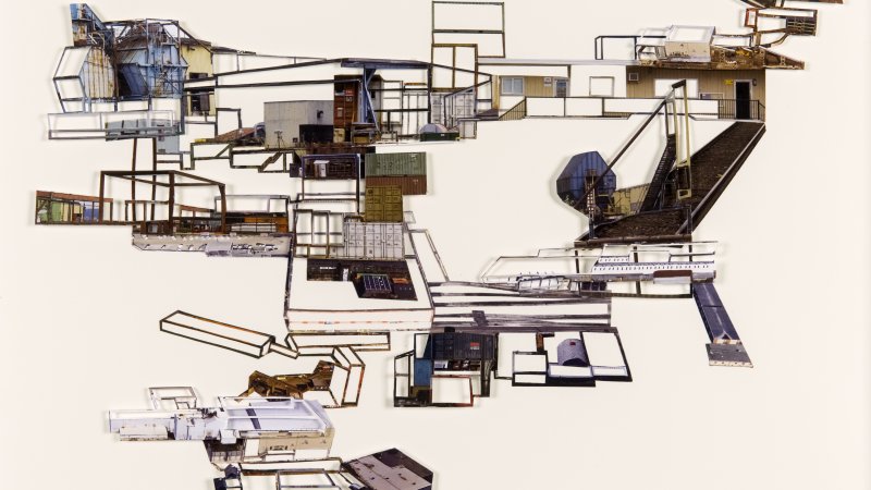 Miniature filigreed collage depicts the contours and history of freight movement of one of British Columbia’s largest rail yards.
