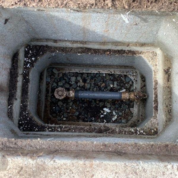 An in-ground water meter in a box