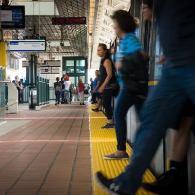 passengers walking off a skytrain