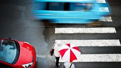 Aerial view of person crossing street