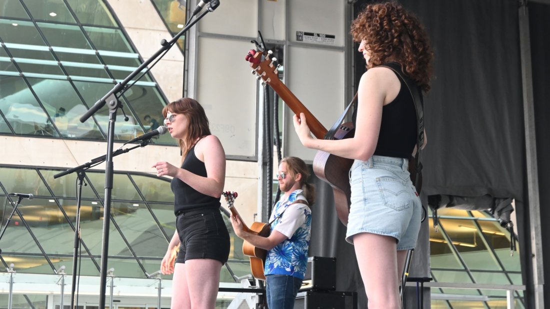a band plays on an outdoor stage
