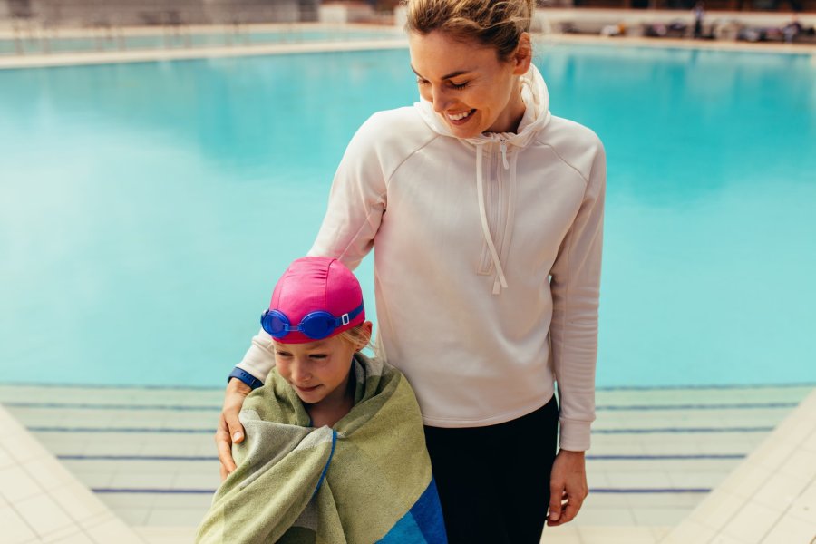 a parent and child with a towel
