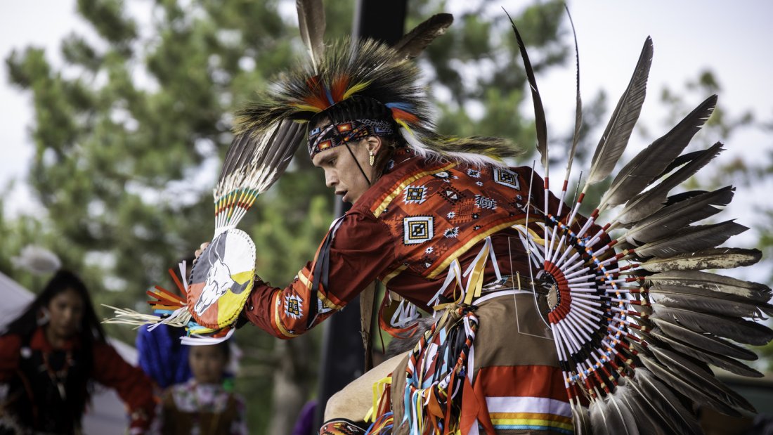 a man performing in a traditional outfit