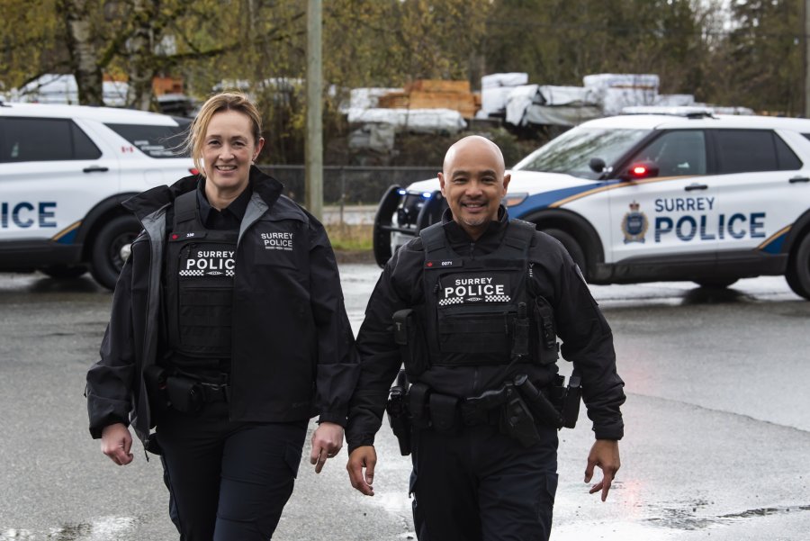 Two police officers smiling