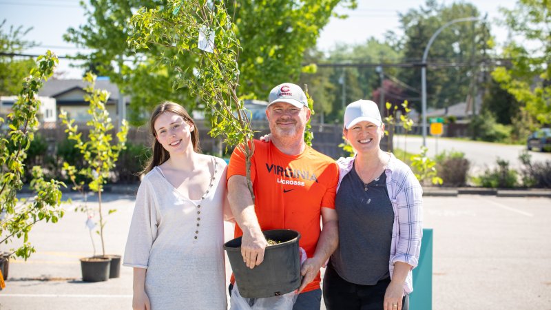 a family picking up a tree at the Surrey Tree sale