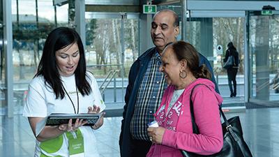 husband and wife take a survey on a tablet