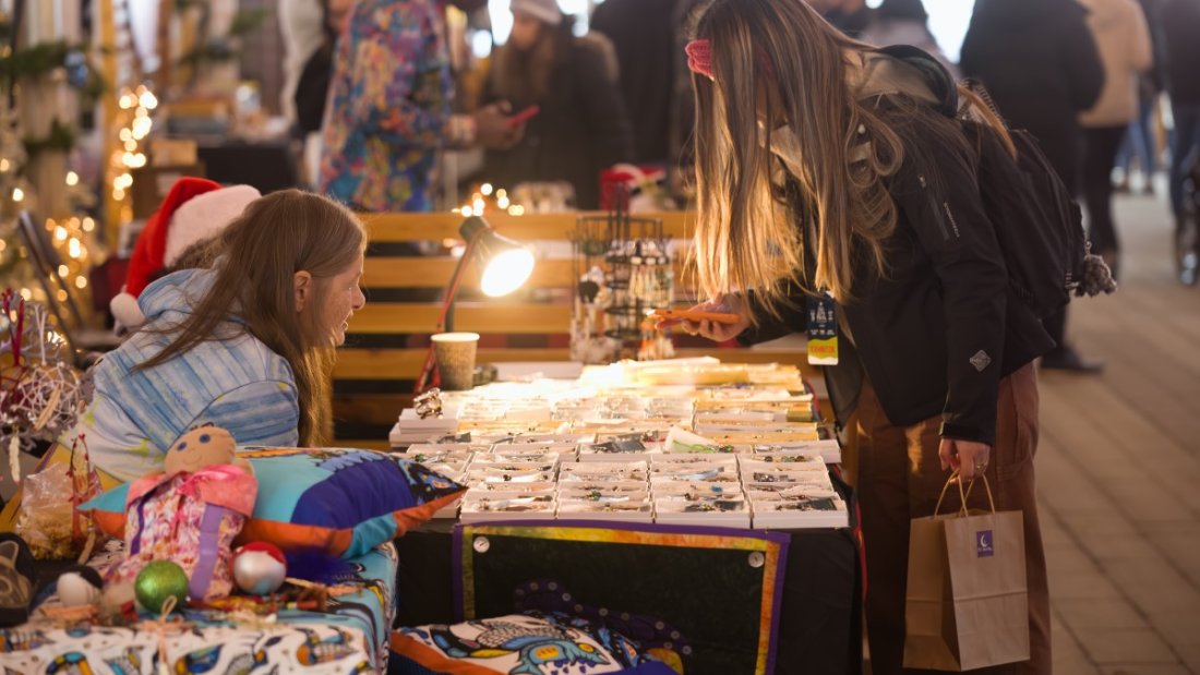 customer talking to vendor at market