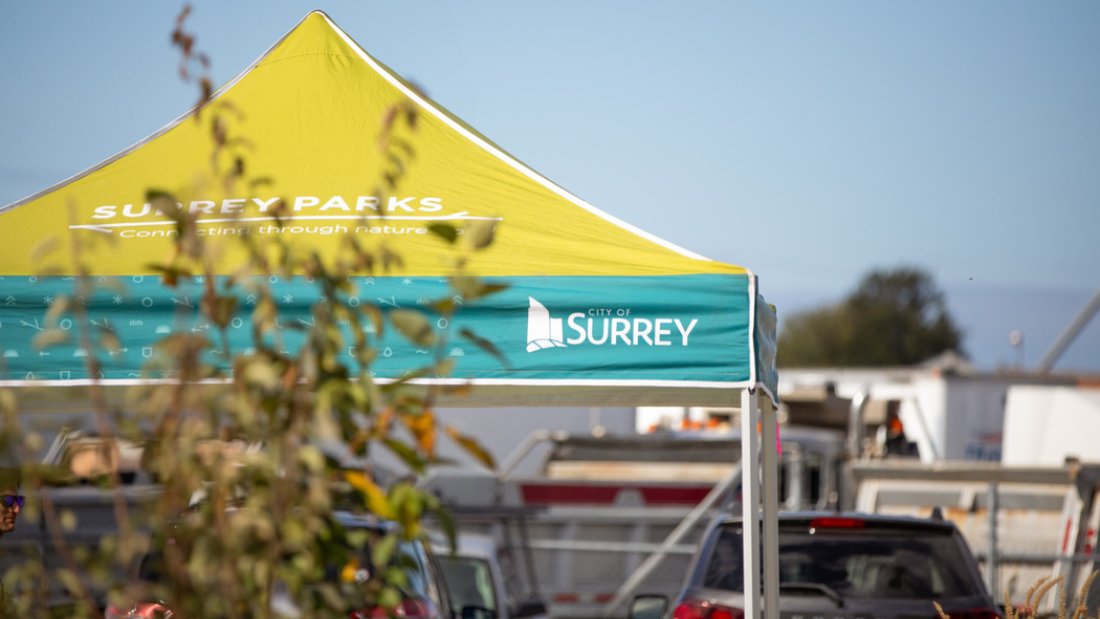 a city of surrey tent being used for worker's shelter during the tree sale