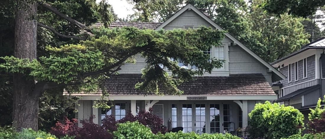 Heritage House with tall trees