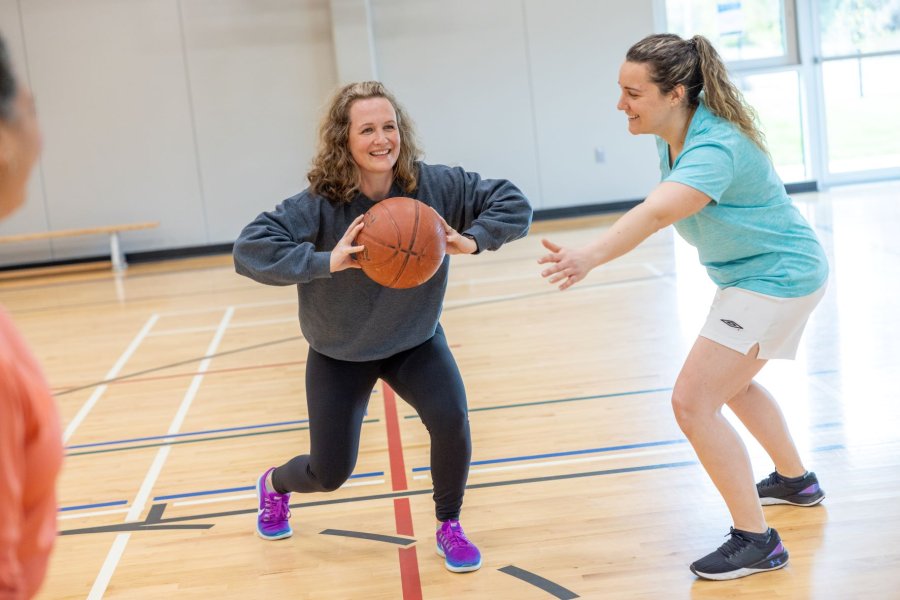 Women playing basketball.