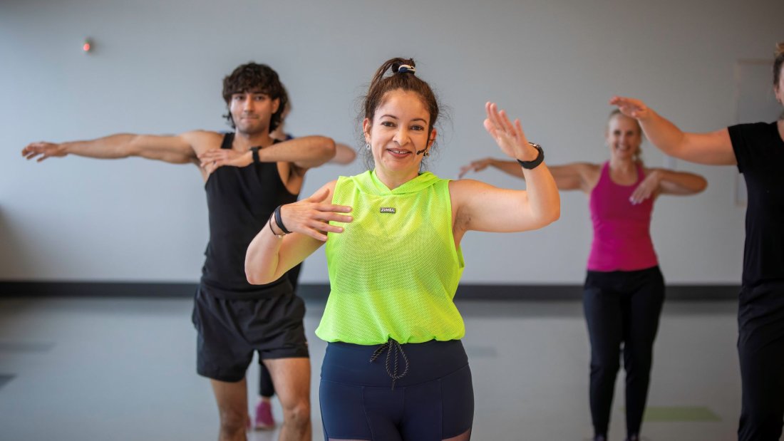 Fitness Instructor teaching a Zumba class.